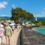 Kona Neighborhoods- Retiree couple walking along Alii Drive Kailua-Kona Hawaii popular retirement neighborhood 2026