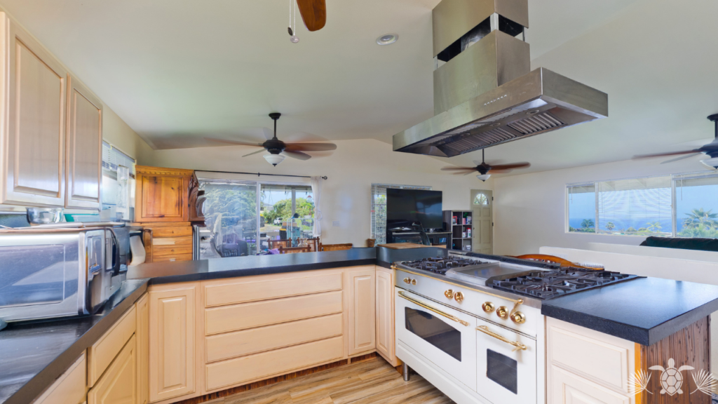 Renovated kitchen with leathered quartz countertops in West Kona home for sale